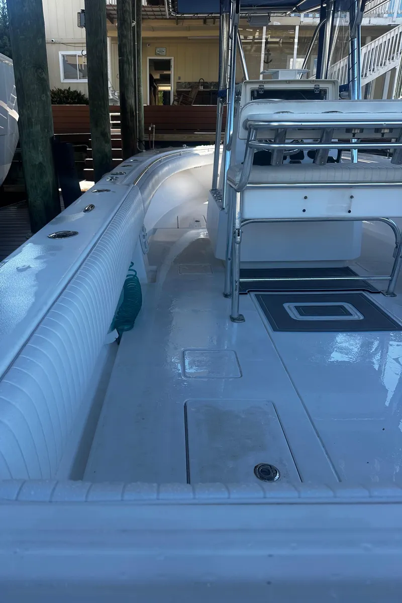 Slide: The Image of 2008 Contender 32 Tournament boat, clean deck, docked, ready for fishing adventures. - 21
