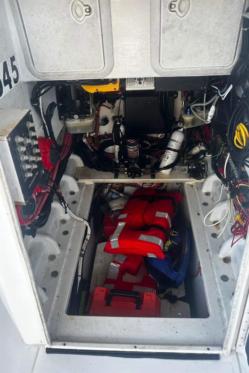 Slide: The Image of 2008 Contender 32 Tournament boat interior with life jackets and wiring. - 23