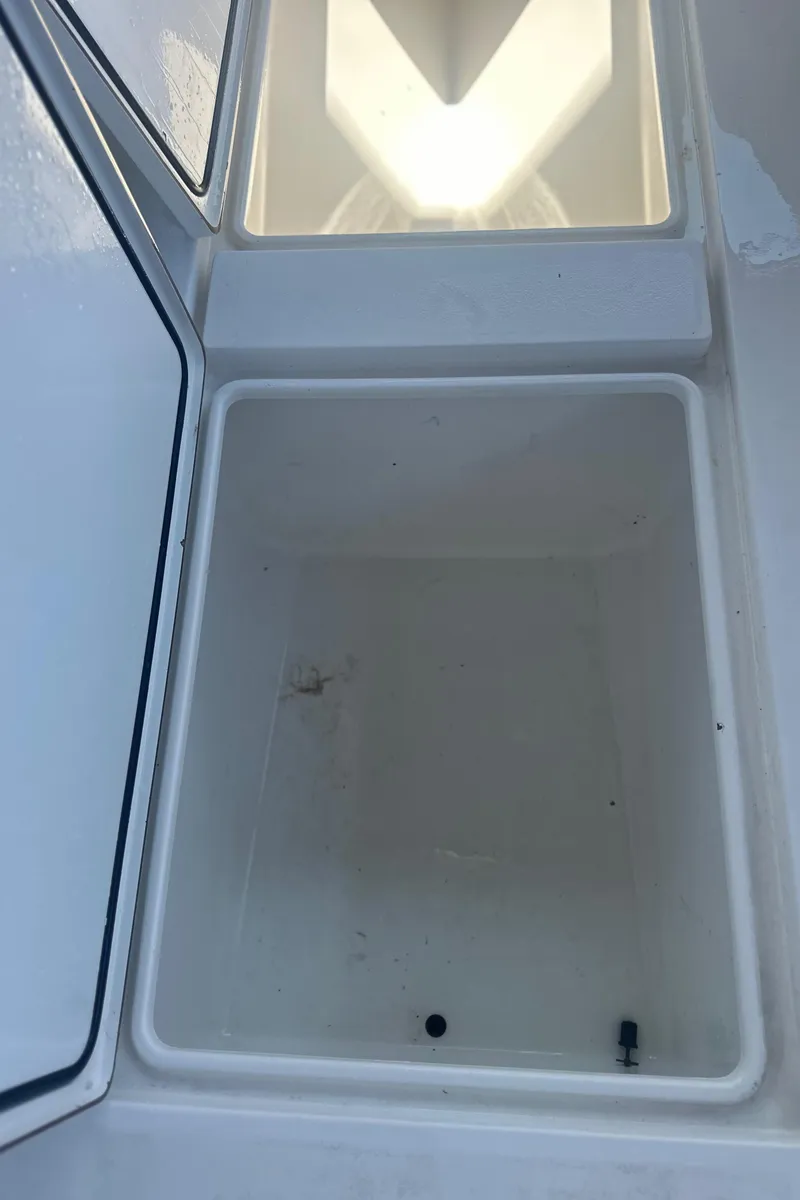 Slide: The Image of 2008 Contender 32 Tournament boat storage compartment, open and empty. - 38