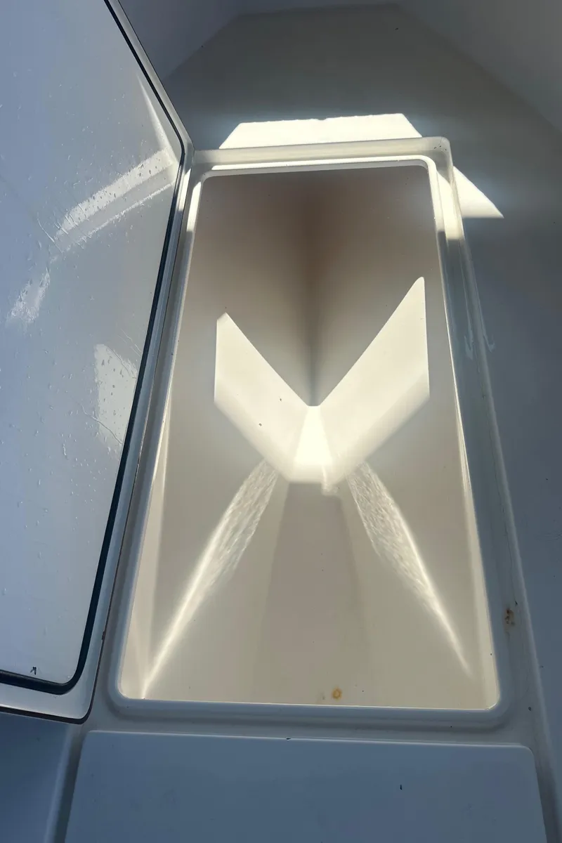 Slide: The Image of 2008 Contender 32 Tournament boat storage compartment, open and empty. - 39