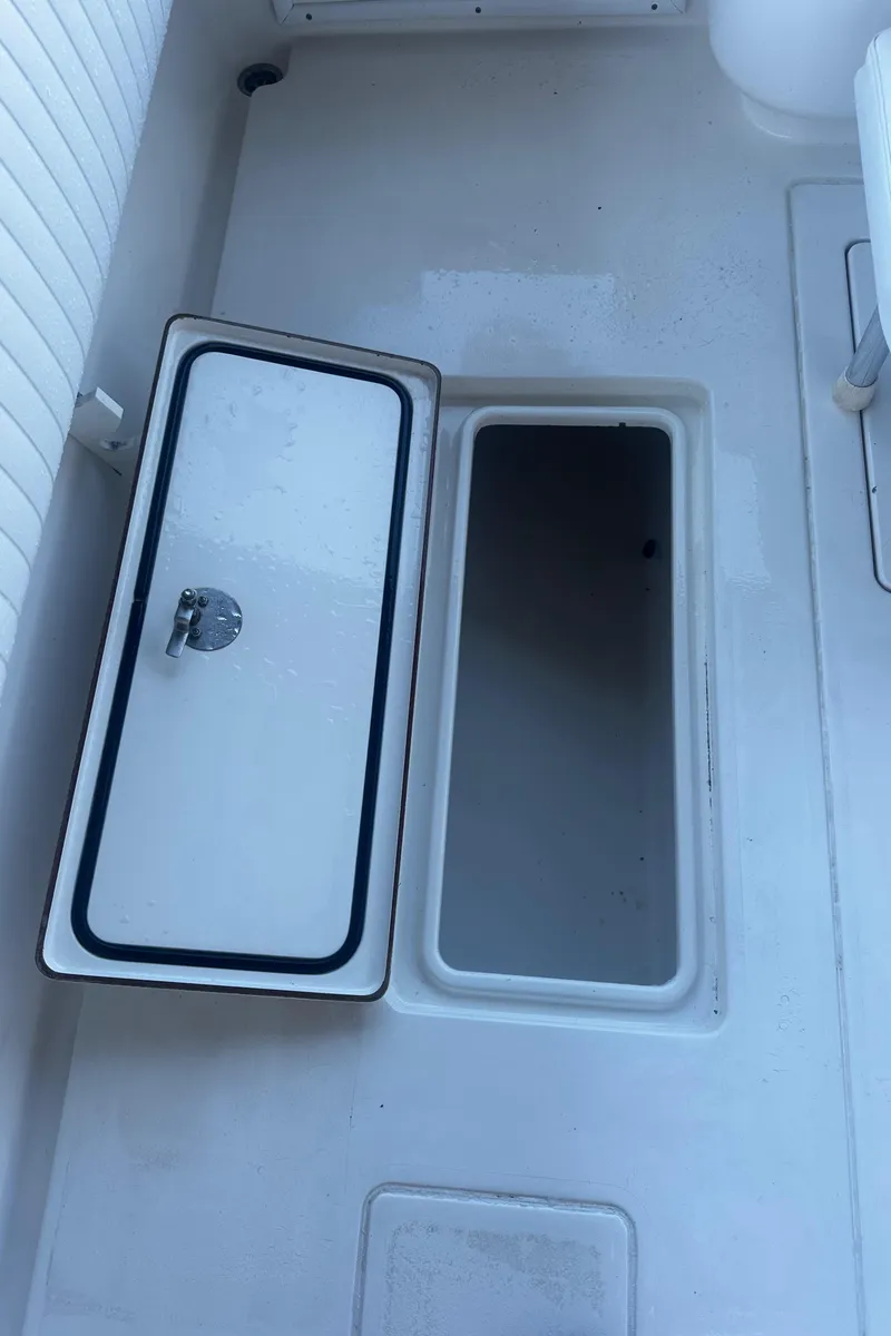 Slide: The Image of Open storage compartment on 2008 Contender 32 Tournament boat deck. - 42