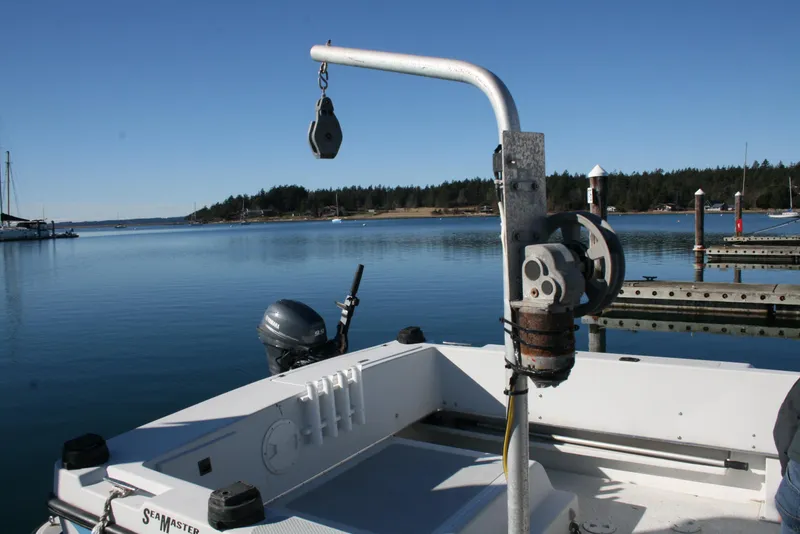 Slide: The Image of 1992 Sea Sport Sea Master 2700 boat docked in a serene marina setting. - 19