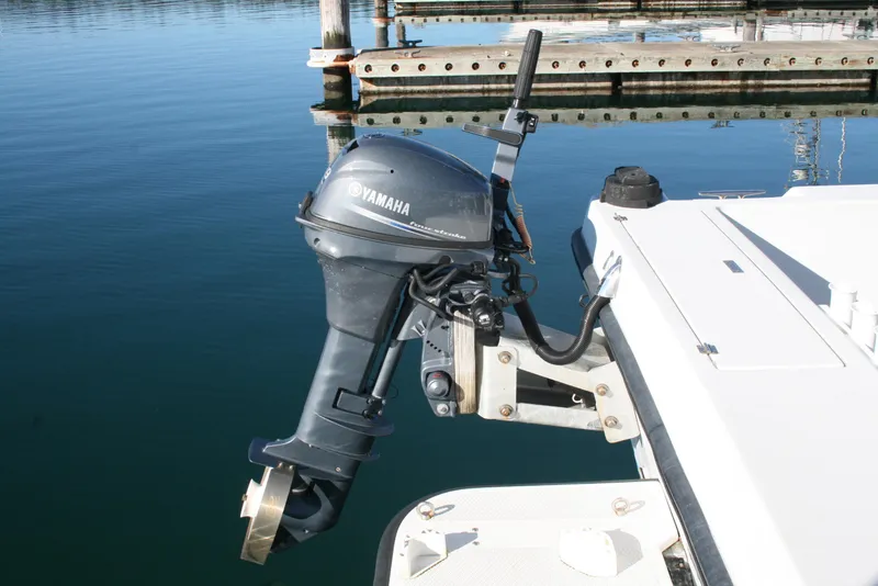 Slide: The Image of Outboard motor on a 1992 Sea Sport Sea Master 2700 at a marina. - 20