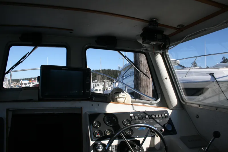 Slide: The Image of Interior view of 1992 Sea Sport Sea Master 2700 boat cockpit with navigation equipment. - 5