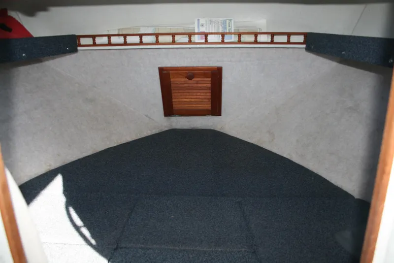 Slide: The Image of Interior cabin of 1992 Sea Sport Sea Master 2700 boat, featuring carpeted flooring. - 7