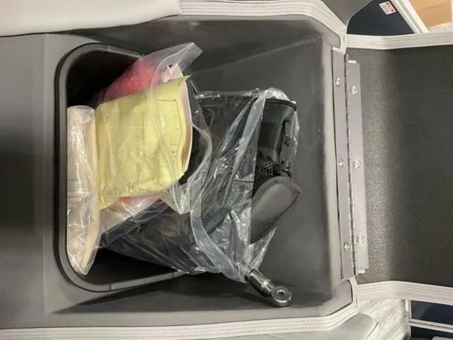 Slide: The Image of Storage compartment of 2025 Bennington S L-Bench 21 SLJ with accessories inside. - 12