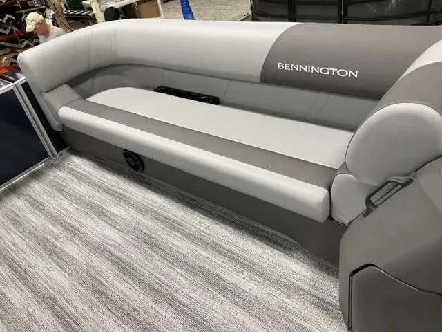 Slide: The Image of 2025 Bennington S L-Bench 21 SLJ boat seating, featuring sleek gray upholstery. - 4
