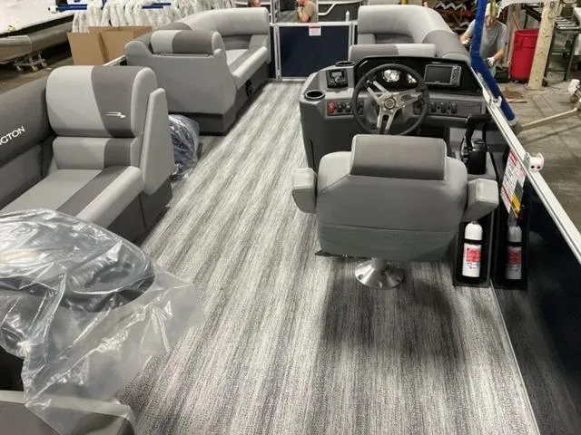 Slide: The Image of 2025 Bennington S L-Bench 21 SLJ pontoon boat interior with gray seating and steering console. - 5