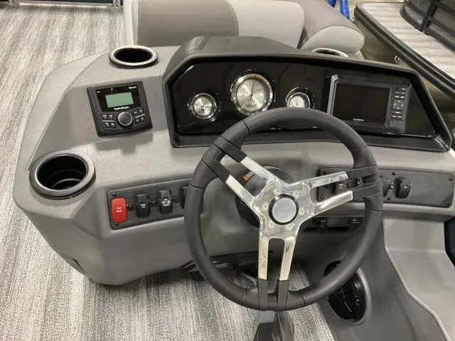 Slide: The Image of Dashboard of 2025 Bennington S L-Bench 21 SLJ boat with steering wheel and controls. - 7