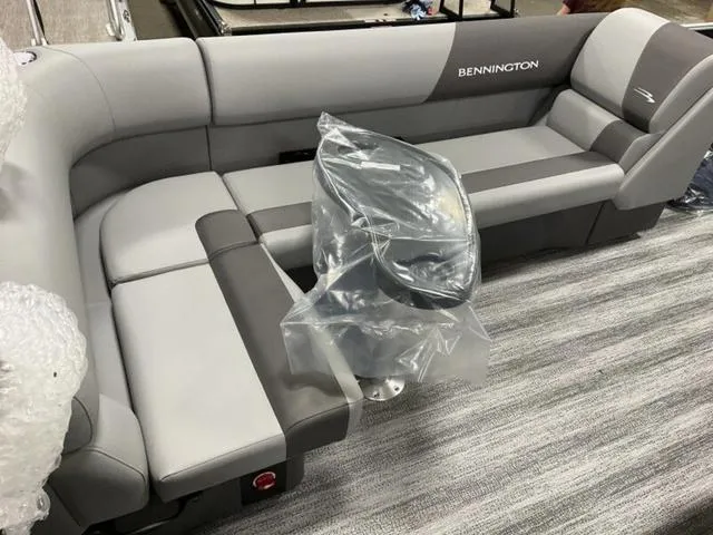 Slide: The Image of 2025 Bennington S L-Bench 21 SLJ boat seating, gray and black upholstery, indoor display. - 8