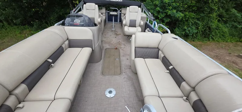 Slide: The Image of 2022 Sun Tracker PB 22 XP3 pontoon boat with spacious seating and lush greenery background. - 15