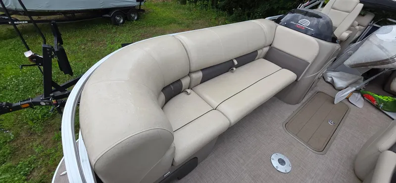 Slide: The Image of 2022 Sun Tracker PB 22 XP3 pontoon boat with beige seating and spacious interior. - 7