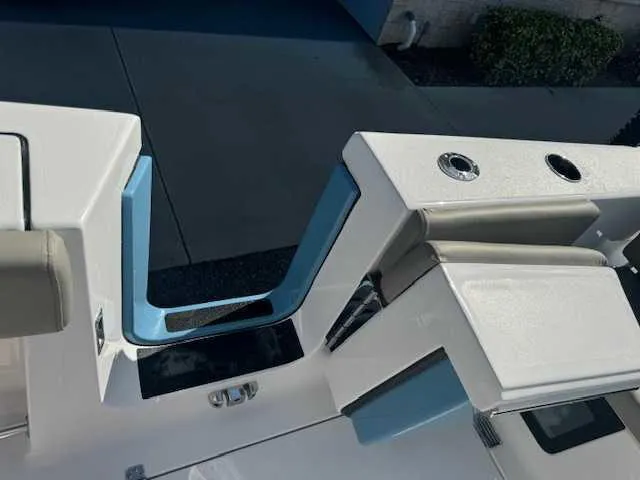 Slide: The Image of 2025 Sportsman Heritage 261 boat interior detail with storage compartment. - 15