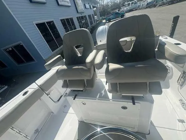 Slide: The Image of 2025 Sportsman Heritage 261 boat battery compartment with wiring and connections. - 19