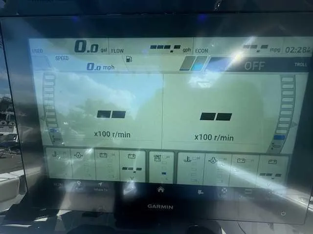 Slide: The Image of Garmin navigation display on 2025 Sportsman Heritage 261 boat, showing map and coordinates. - 24