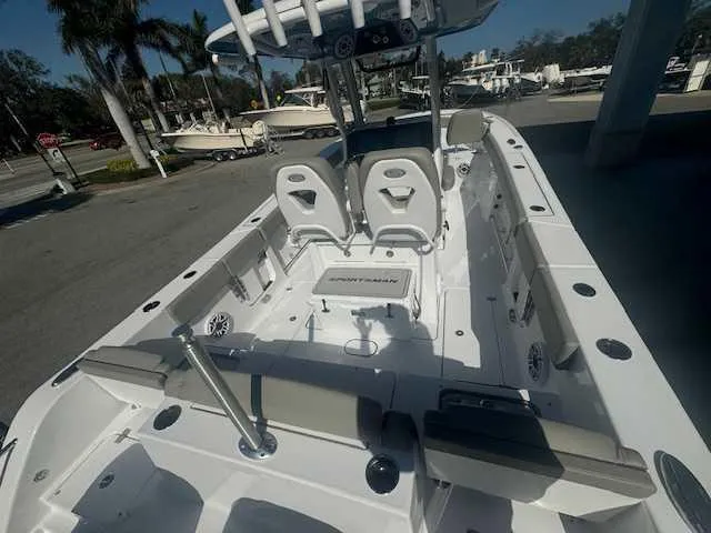 Slide: The Image of 2025 Sportsman Heritage 261 boat with dual engines and spacious seating area. - 6