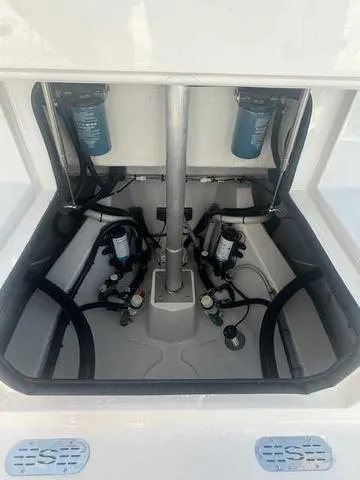 Slide: The Image of 2025 Sportsman Heritage 261 boat interior showing wiring and plumbing details. - 8
