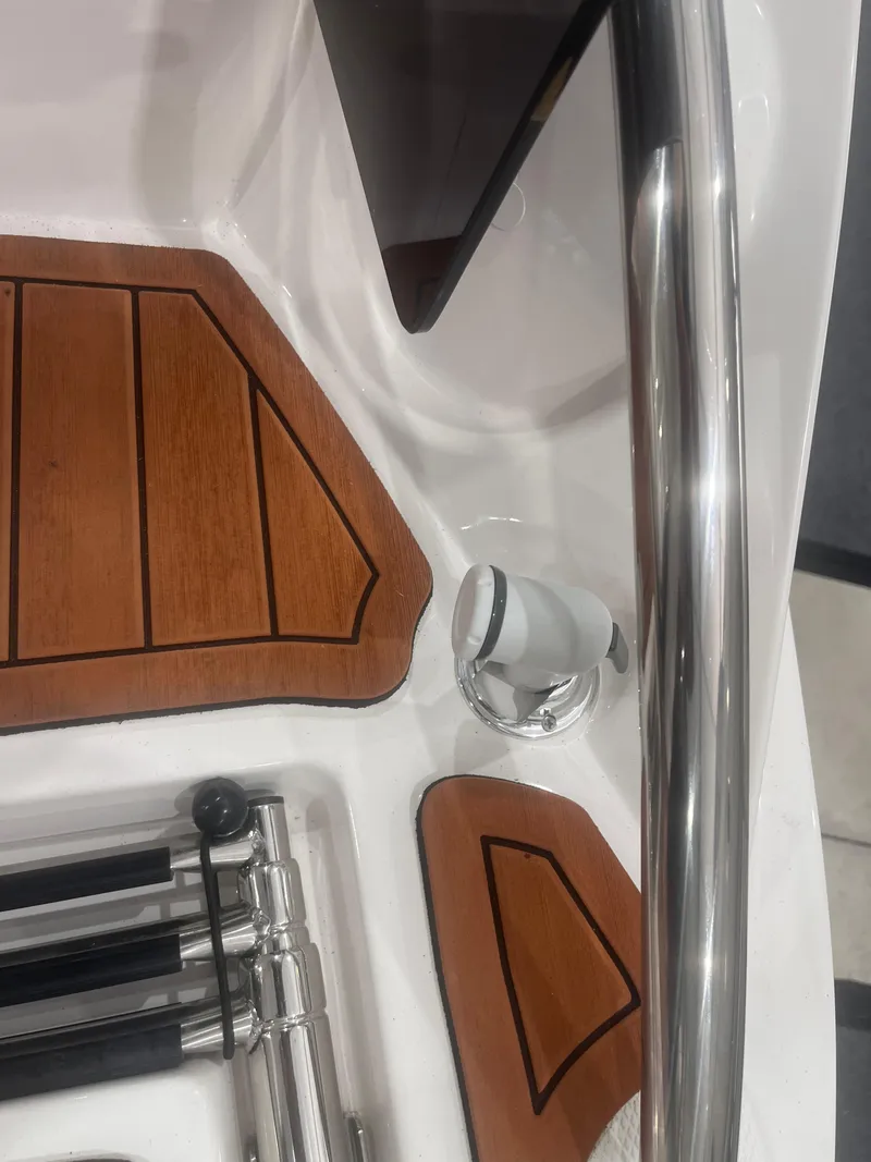 Slide: The Image of Ventura 195 Crossover 2025 boat interior with wood accents and stainless steel details. - 10