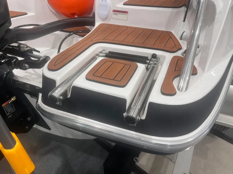 Slide: The Image of 2025 Ventura 195 Crossover boat with teak deck and stainless steel ladder. - 17