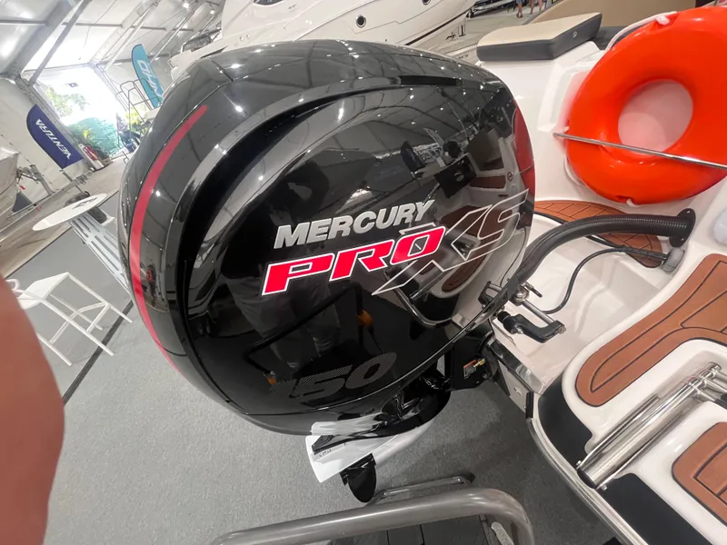 Slide: The Image of Mercury Pro XS engine on 2025 Ventura 195 Crossover boat, displayed indoors. - 20