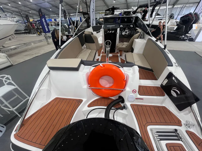 Slide: The Image of 2025 Ventura 195 Crossover boat interior with seating and life preserver on display. - 8