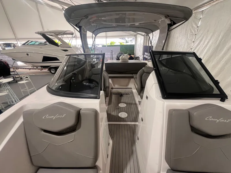 Slide: The Image of 2025 Ventura 252 Comfort boat interior with sleek design and modern seating arrangement. - 10