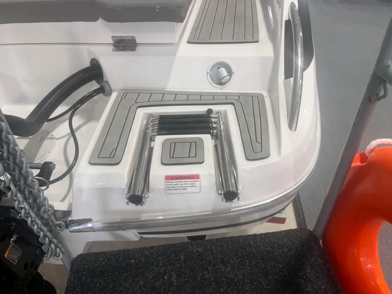 Slide: The Image of 2025 Ventura 252 Comfort boat with integrated swim ladder and deck details. - 4