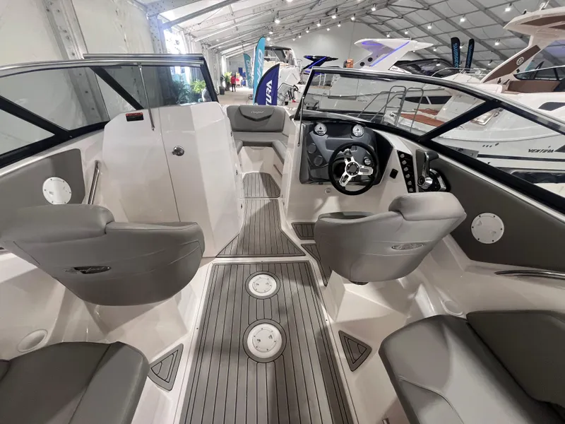 Slide: The Image of 2025 Ventura 252 Comfort boat interior with sleek design and modern seating arrangement. - 7