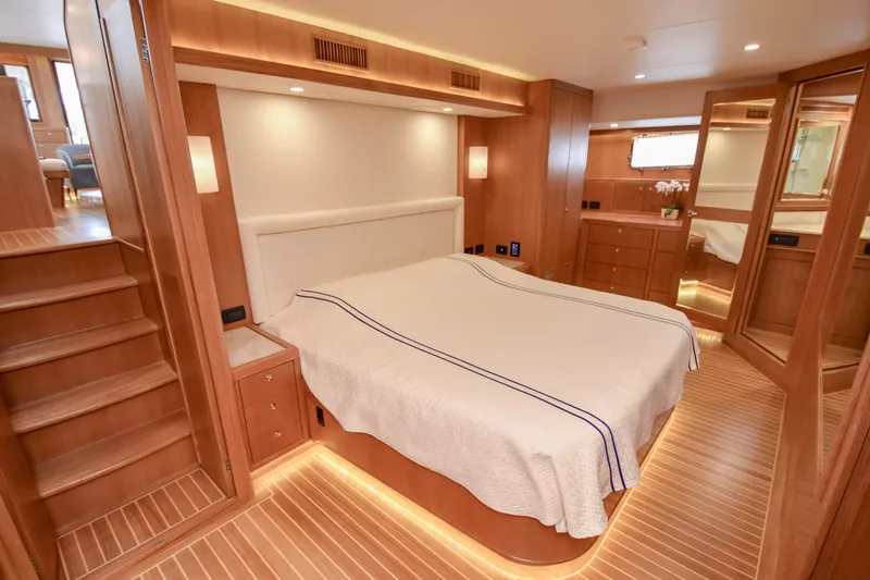 Slide: The Image of Luxurious cabin interior of 2020 Fleming 78 yacht with wooden finishes and cozy lighting. - 12