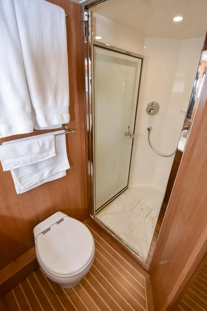 Slide: The Image of Modern bathroom on 2020 Fleming 78 yacht with shower and toilet. - 16