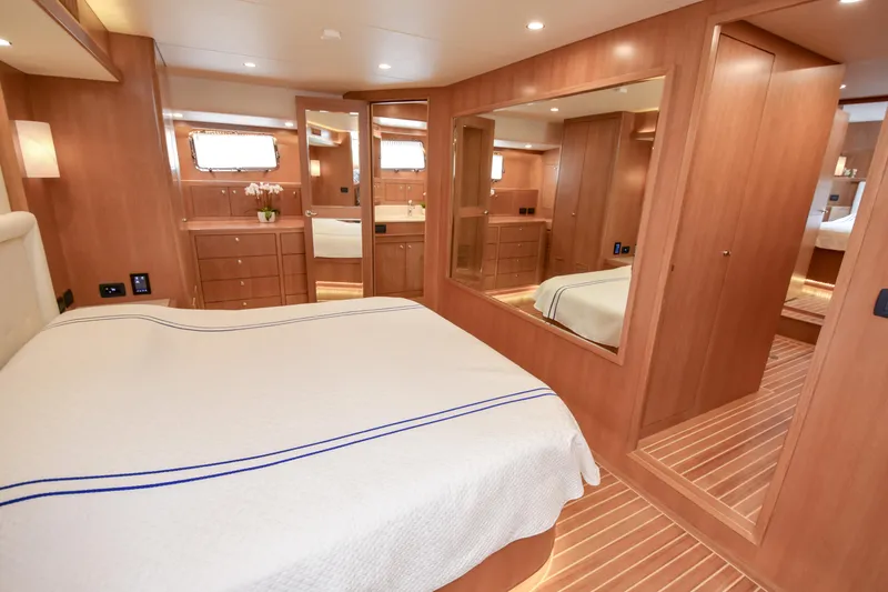 Slide: The Image of Luxurious bedroom interior of 2020 Fleming 78 yacht with wooden furnishings and elegant decor. - 17