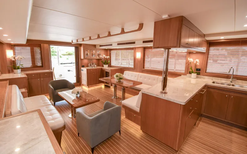 Slide: The Image of Luxurious interior of 2020 Fleming 78 yacht with elegant wood finishes and modern furnishings. - 2