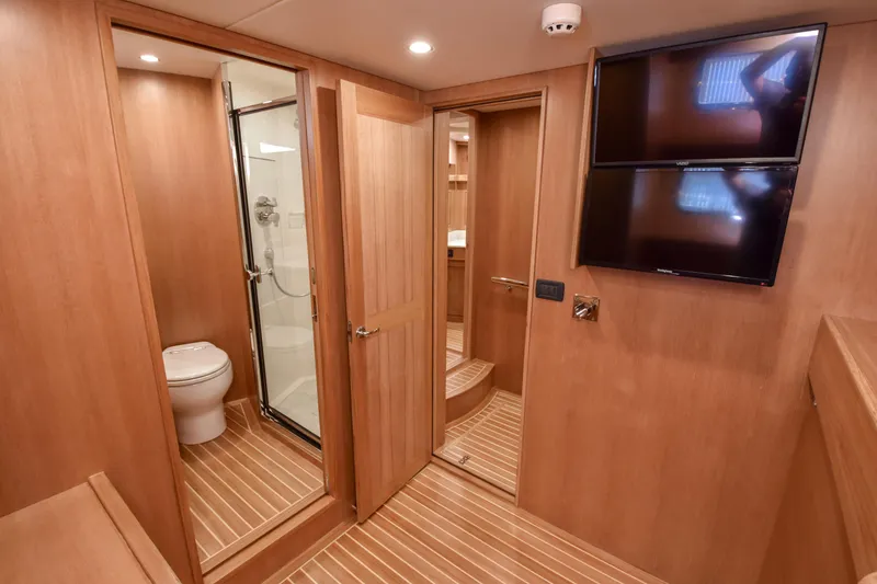 Slide: The Image of Luxurious bathroom interior of 2020 Fleming 78 yacht with wood finish and modern amenities. - 20