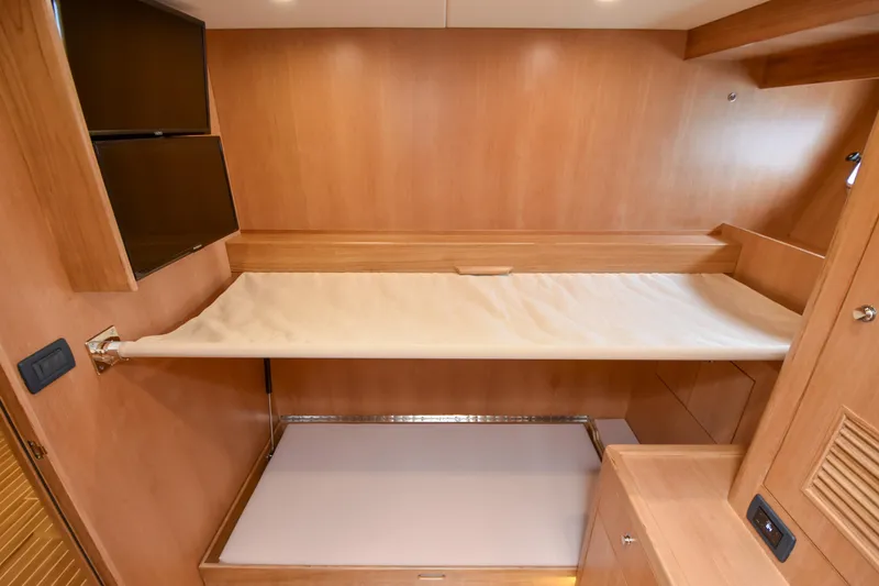 Slide: The Image of Interior of 2020 Fleming 78 yacht with wooden bunk beds and modern design. - 23