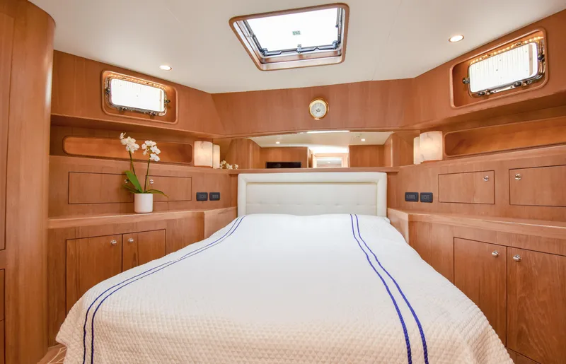 Slide: The Image of Luxurious cabin interior of a 2020 Fleming 78 yacht with elegant wood finish. - 25
