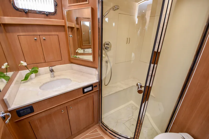 Slide: The Image of Luxurious bathroom in 2020 Fleming 78 yacht with marble countertop and glass shower. - 26