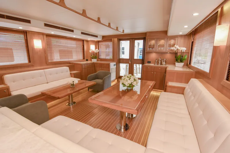 Slide: The Image of Luxurious interior of 2020 Fleming 78 yacht with elegant wood finishes and plush seating. - 3