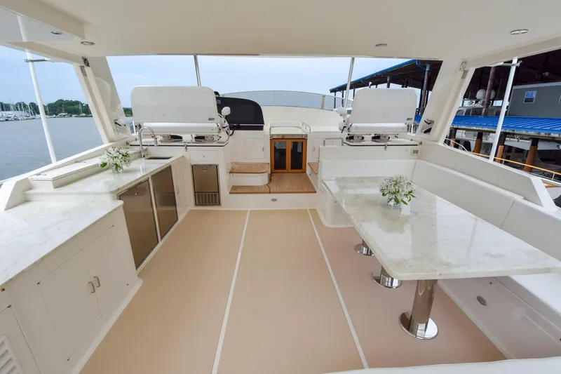 Slide: The Image of Luxurious 2020 Fleming 78 yacht deck with elegant seating and dining area. - 35