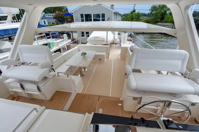 Slide: The Image of Luxurious 2020 Fleming 78 yacht interior with white seating and elegant design. - 36