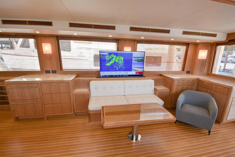 Slide: The Image of Luxurious Fleming 78 yacht interior with modern furnishings and large TV, 2020 model. - 4