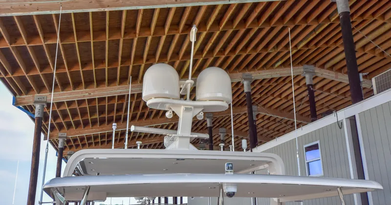 Slide: The Image of 2020 Fleming 78 yacht radar equipment under wooden dock roof. - 47