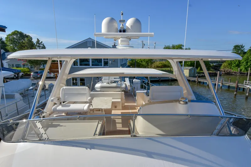 Slide: The Image of Luxury Fleming 78 yacht, 2020 model, docked with spacious upper deck and seating area. - 48