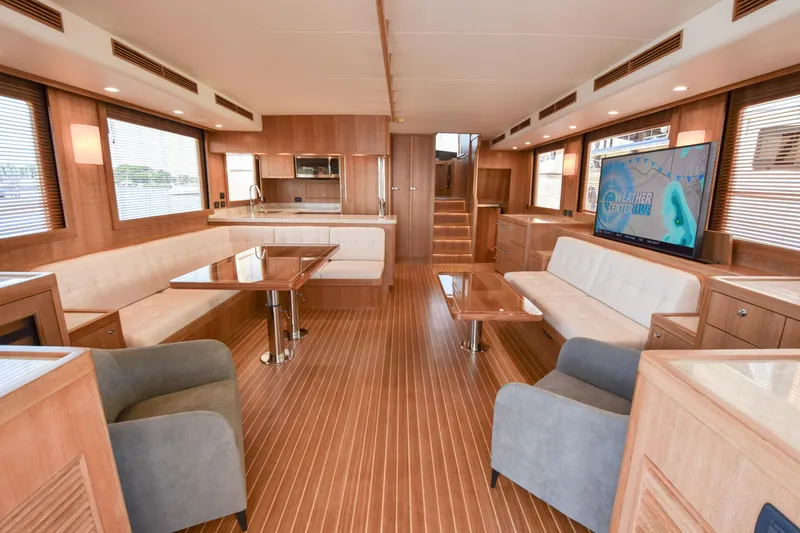 Slide: The Image of Luxurious interior of 2020 Fleming 78 yacht with modern furnishings and wood accents. - 6
