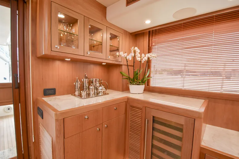 Slide: The Image of Luxurious wooden interior of 2020 Fleming 78 yacht with elegant cabinetry and decor. - 7