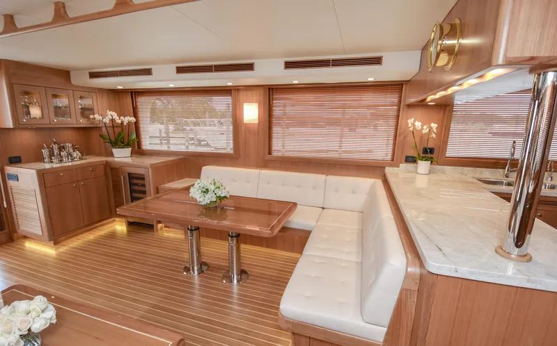 Slide: The Image of Luxurious interior of 2020 Fleming 78 yacht with elegant wood finishes and plush seating. - 8