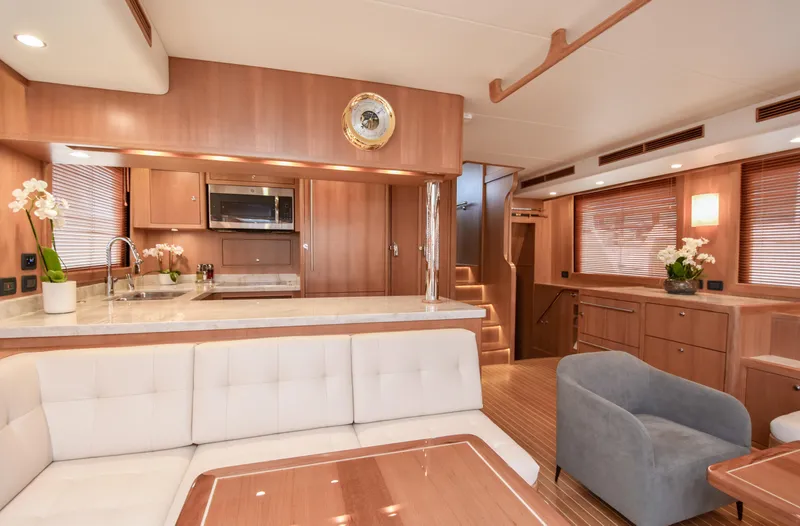 Slide: The Image of Luxurious interior of 2020 Fleming 78 yacht with modern kitchen and elegant seating area. - 9