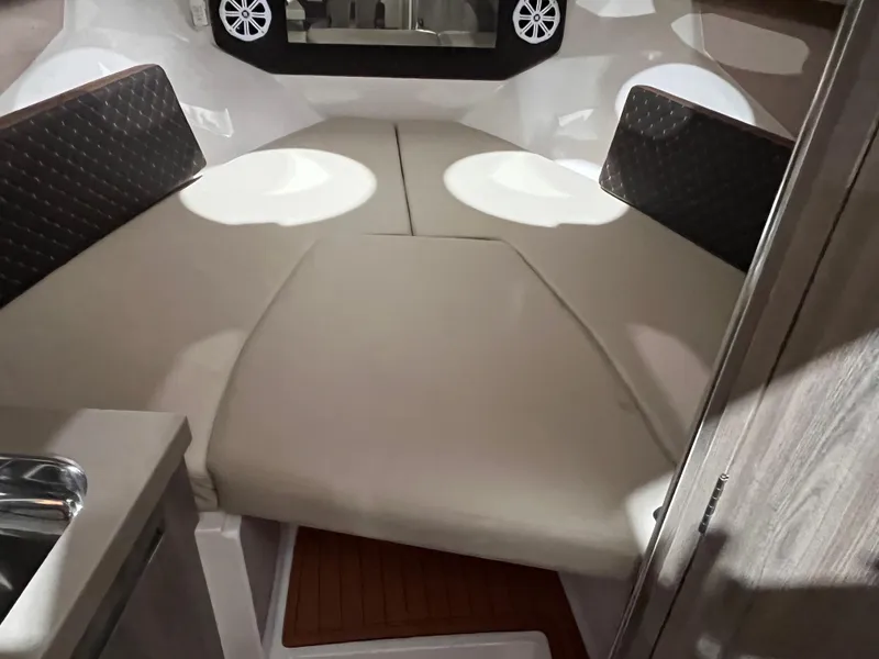 Slide: The Image of 2025 Ventura DayCruiser interior cabin with cushioned seating and modern design. - 9
