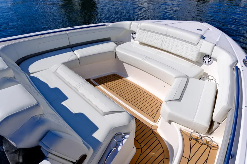 Slide: The Image of Luxurious seating area on 2023 Tiara Yachts 48 LS, featuring elegant white upholstery. - 14