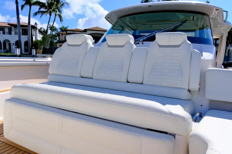 Slide: The Image of Luxurious seating on 2023 Tiara Yachts 48 LS, featuring elegant white upholstery. - 16