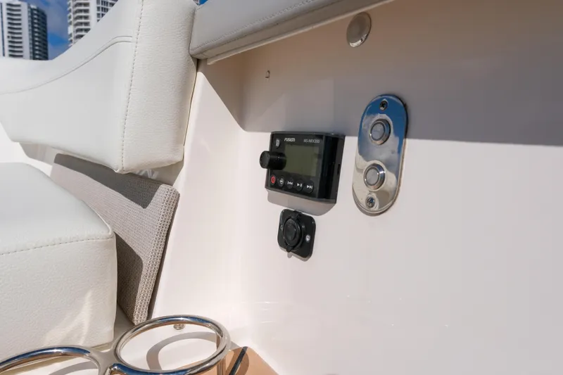Slide: The Image of 2023 Tiara Yachts 48 LS interior detail with control panel and cup holders. - 17